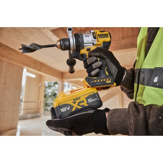 8Ah battery being attached to 18V XR Brushless Premium Hammer Drill Driver