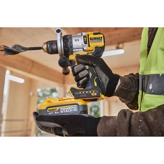 Powerstack 5Ah battery being attached to 18V XR Brushless Premium Hammer Drill Driver