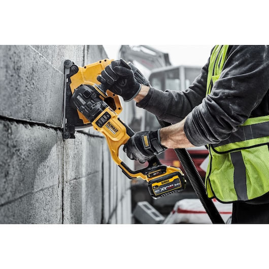 Image of the Grinder being used on concrete wall
