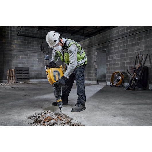 Cordless XR Flexvolt Breaker Hammer breaking a concrete floor