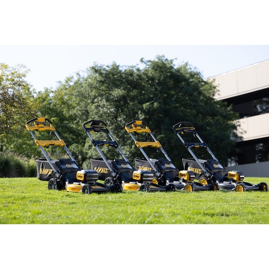 Dewalt lawn mowers DCMWP134, DCMWSP156, DCMWP500 and DCMWSP550 on grass