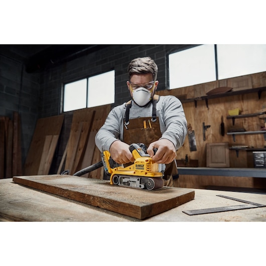 18V XR Brushless Belt Sander sanding a wooden shelf