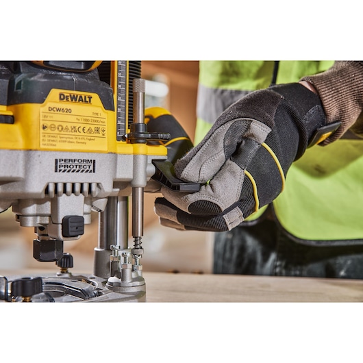 Close up of worker adjusting plunge depth