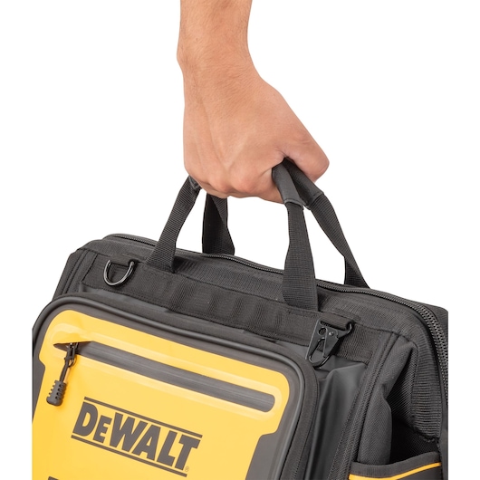 Dewalt 16" Pro Open Mouth Tool Bag being carried"